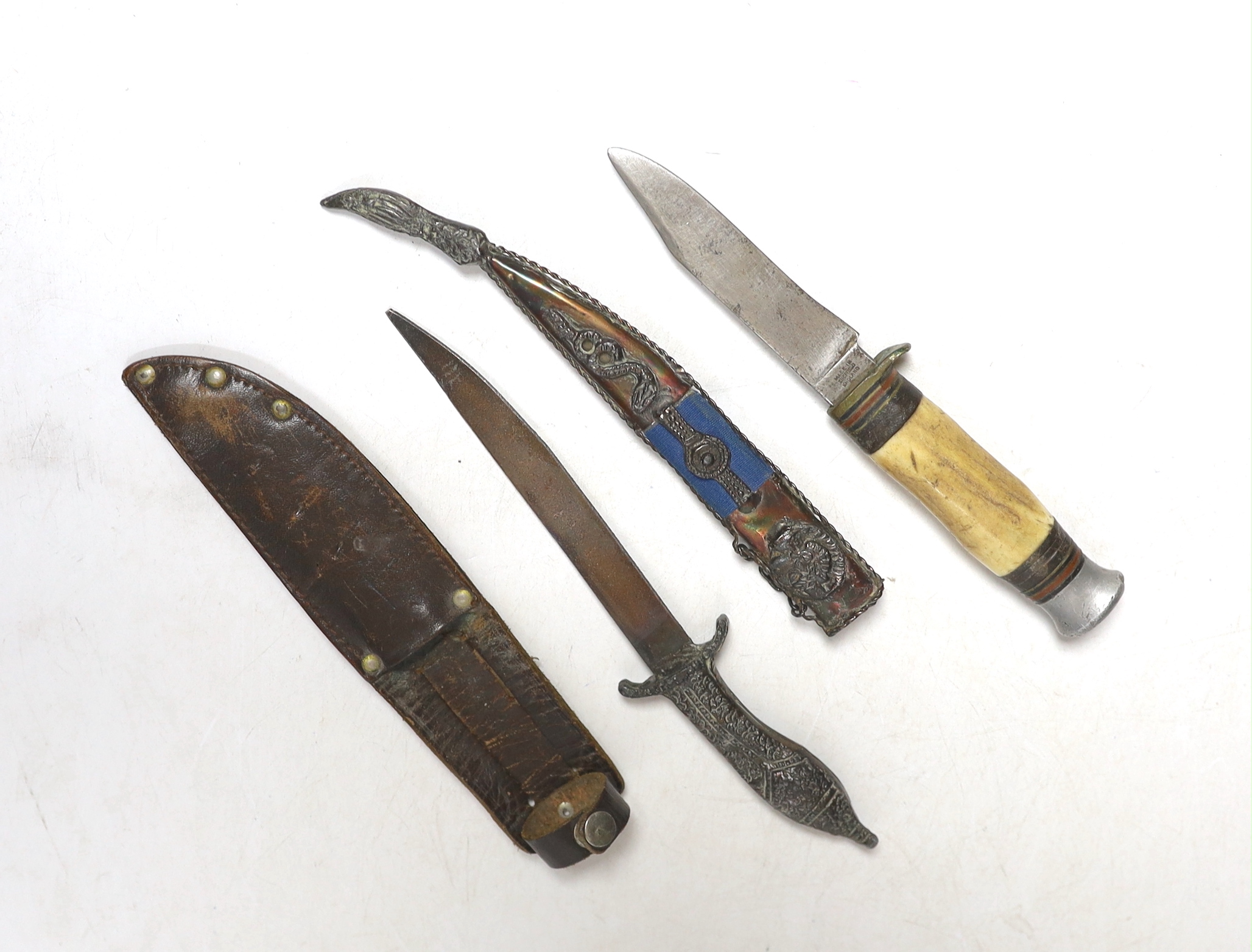 A William Roger’s stag antler handled dagger with leather sheathe and another dagger, blade stamped 1821